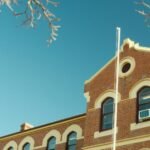 a brick building with a blue sky