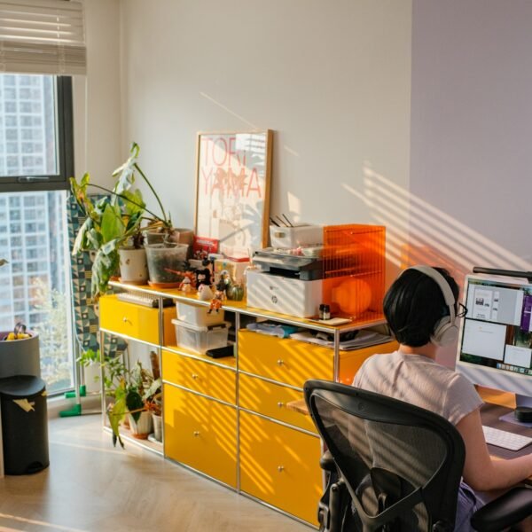 A person is working at a bright home office.